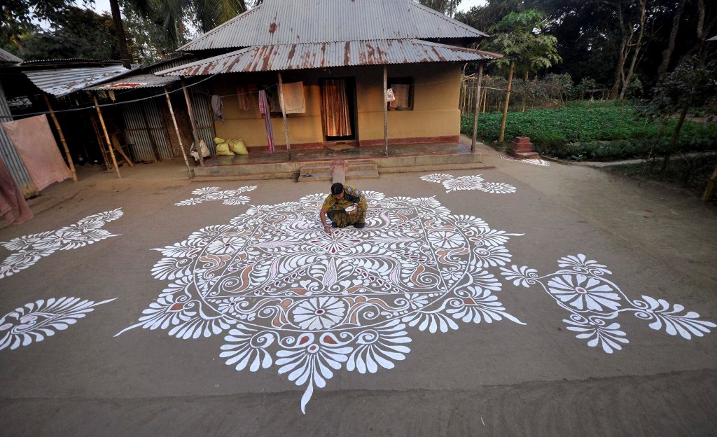 Woman Making Rangoli in Agartala on Makar Shankaranti